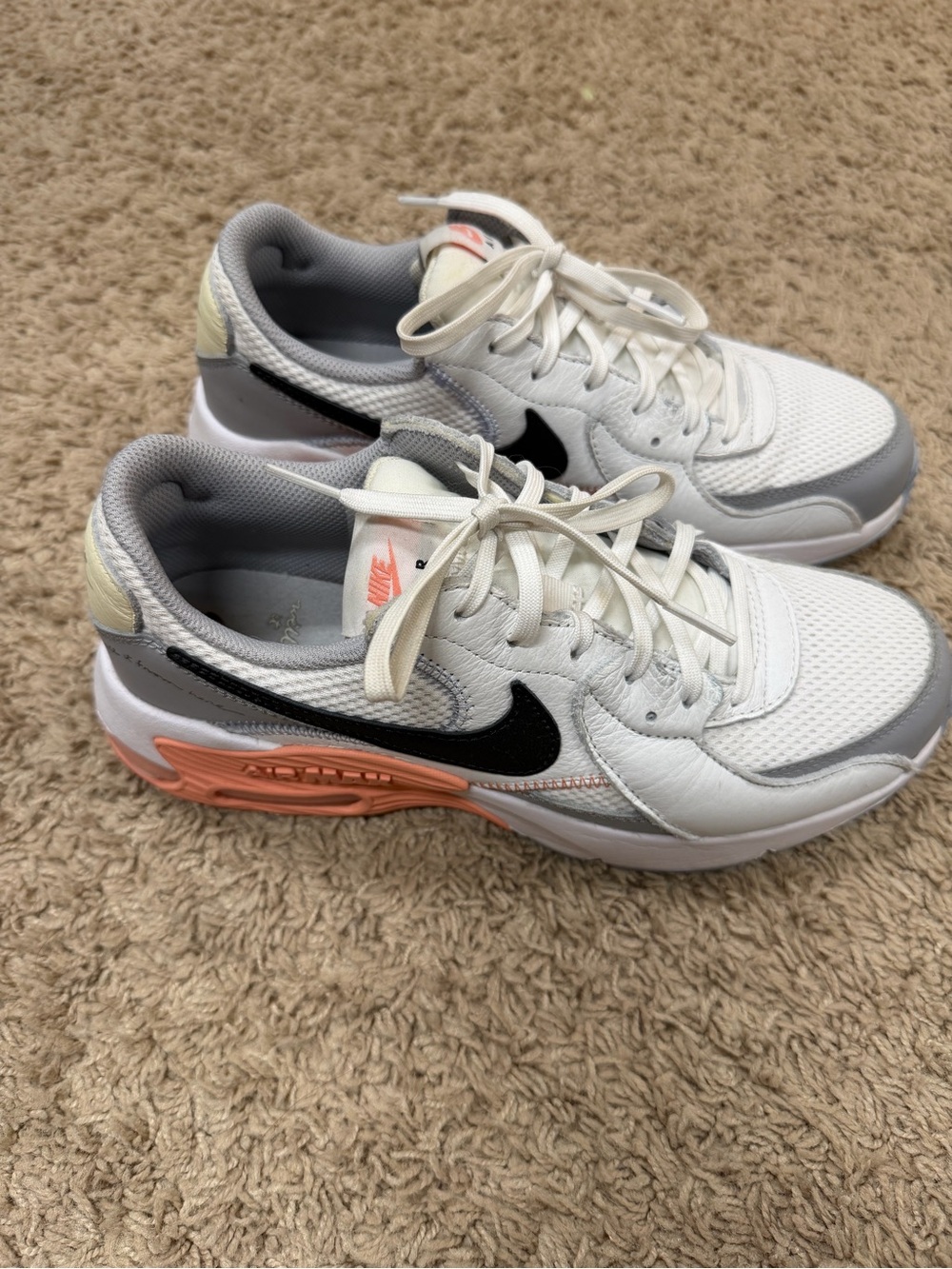 Nike Women’s White Mesh Running Shoes with Black Swoosh and Coral Accent
